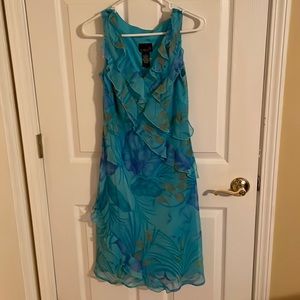 Scarlett’s dress. Size 8. Green, purple, gold flowers.